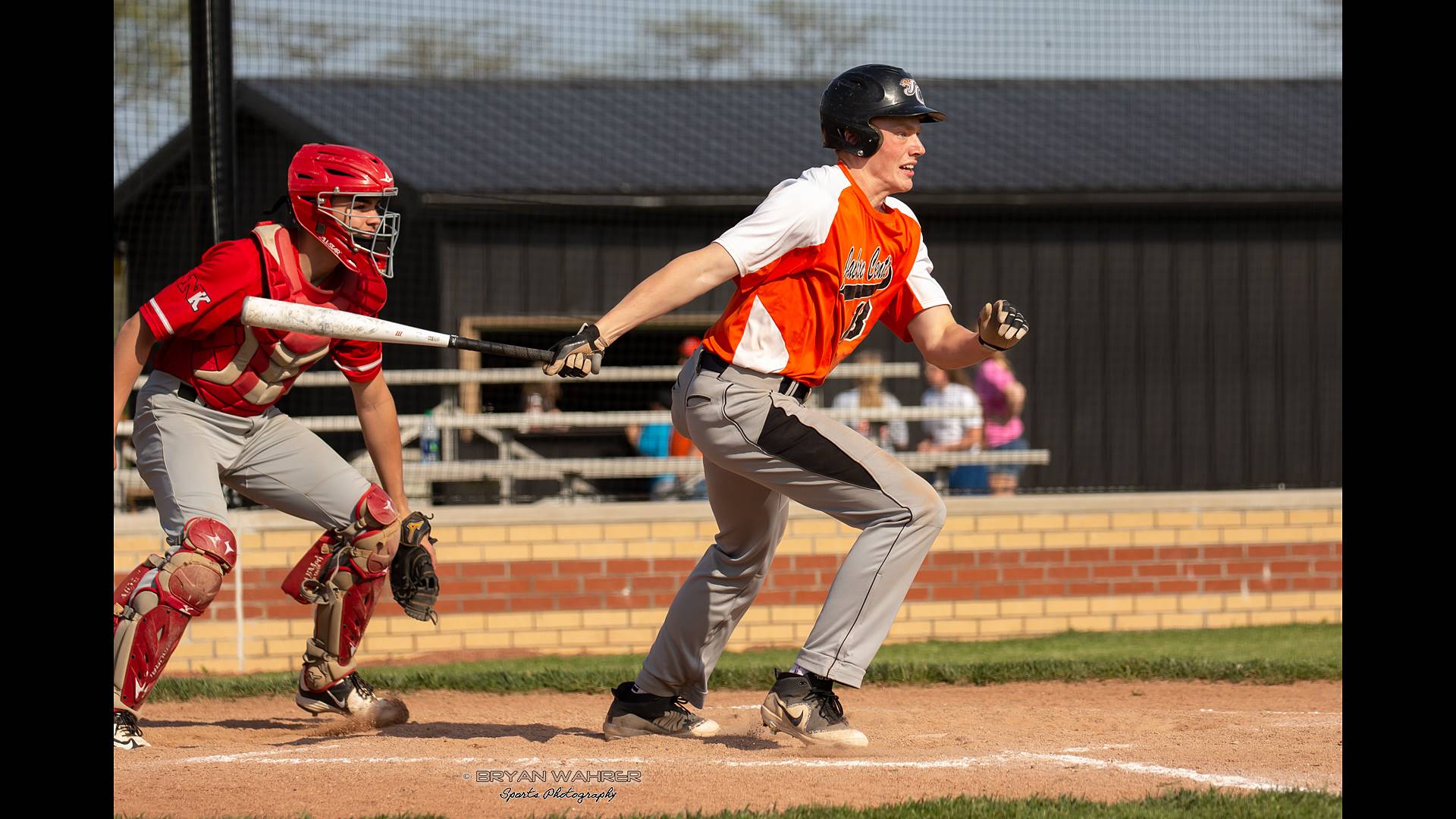 baseball player heading for first base