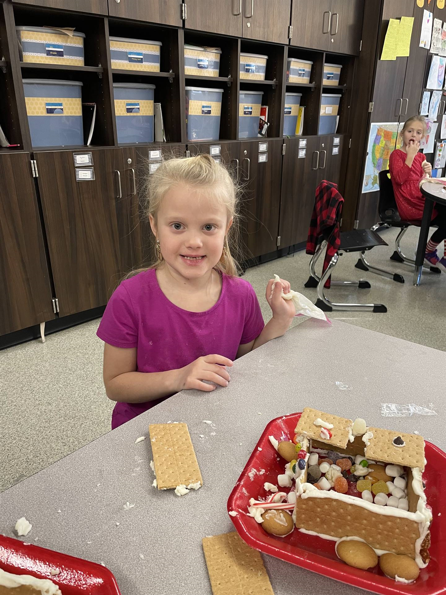 Maleah with gingerbread house