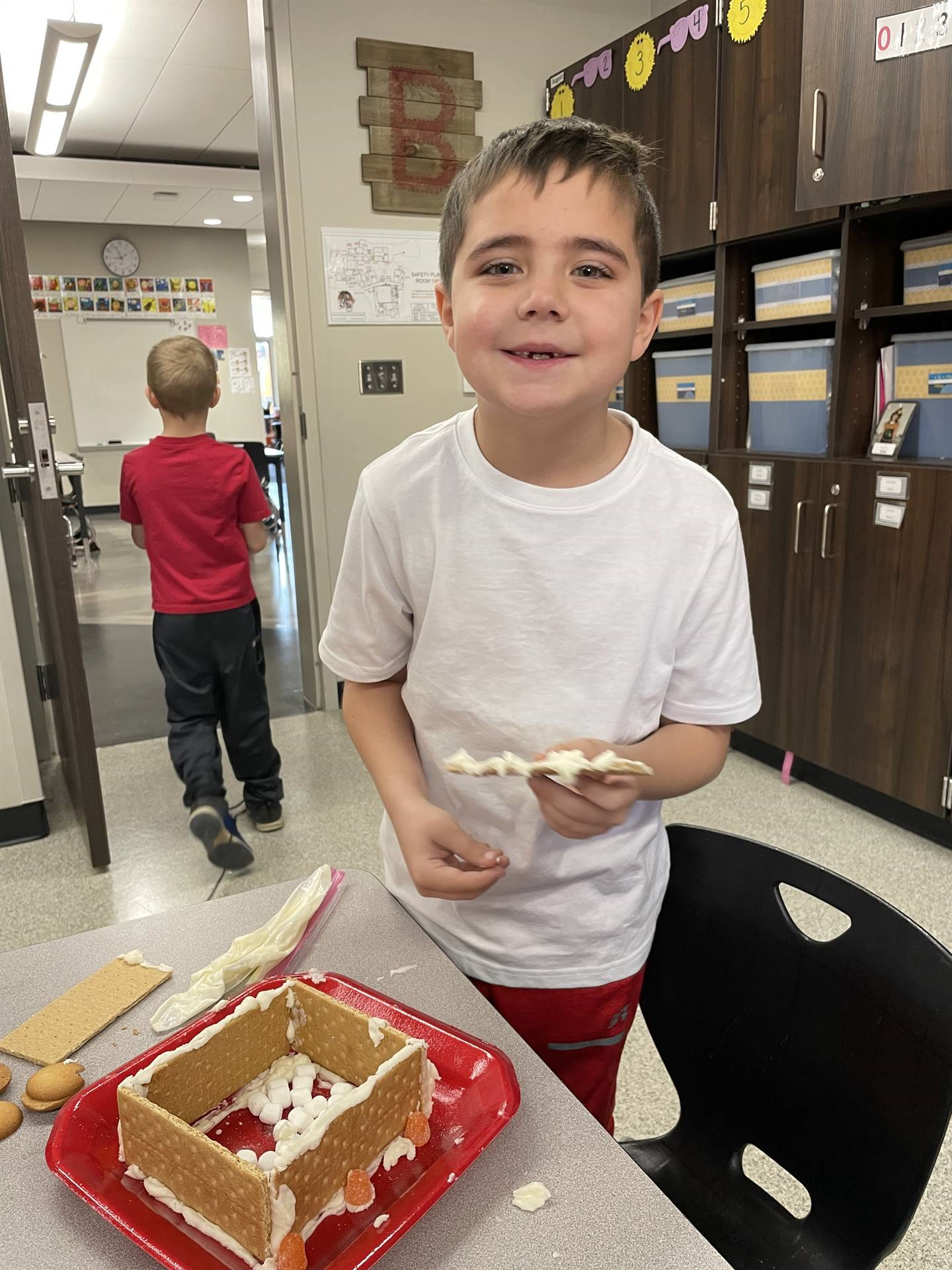 Ethan with gingerbread house