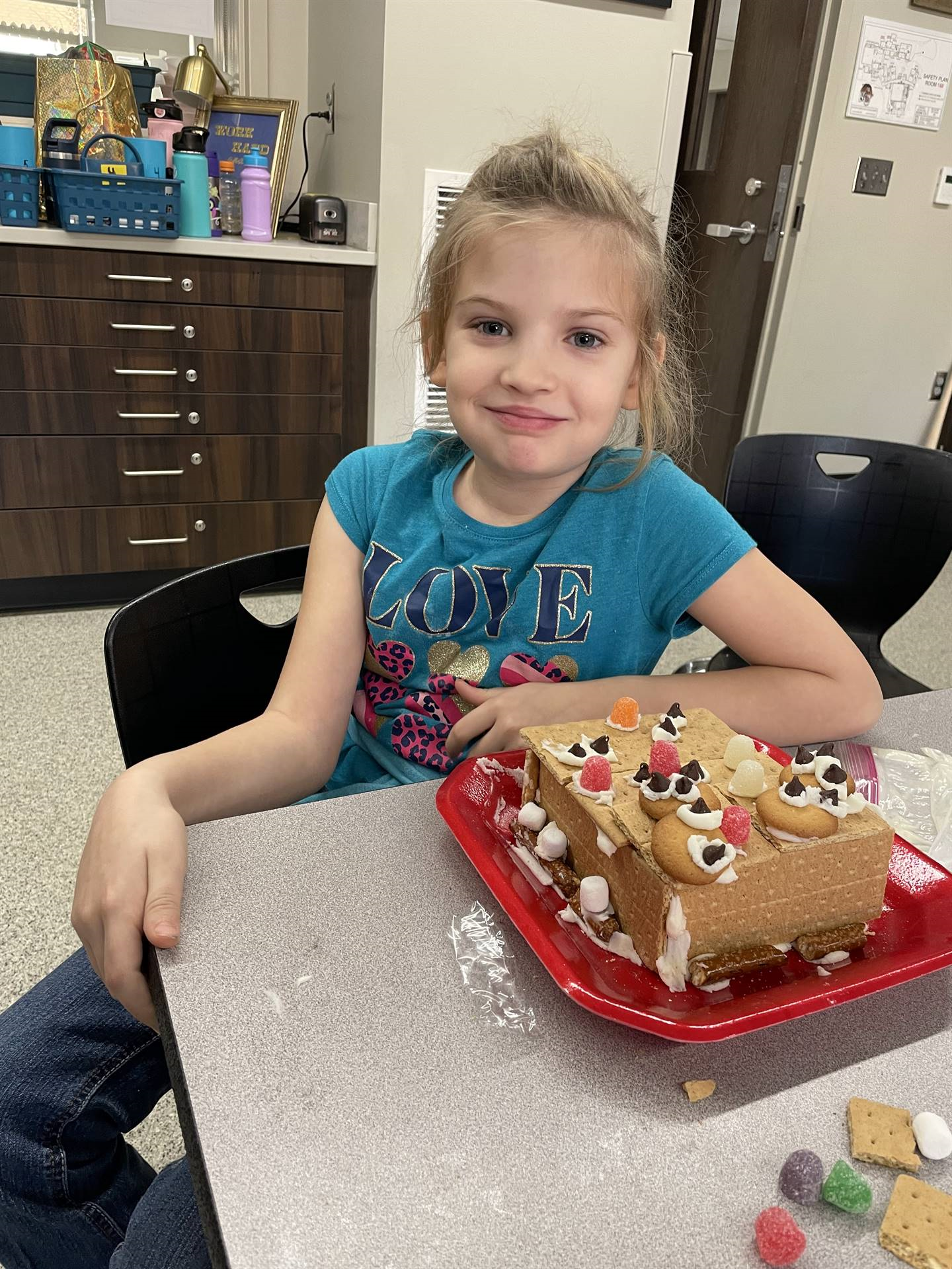 Kalleigh with gingerbread house