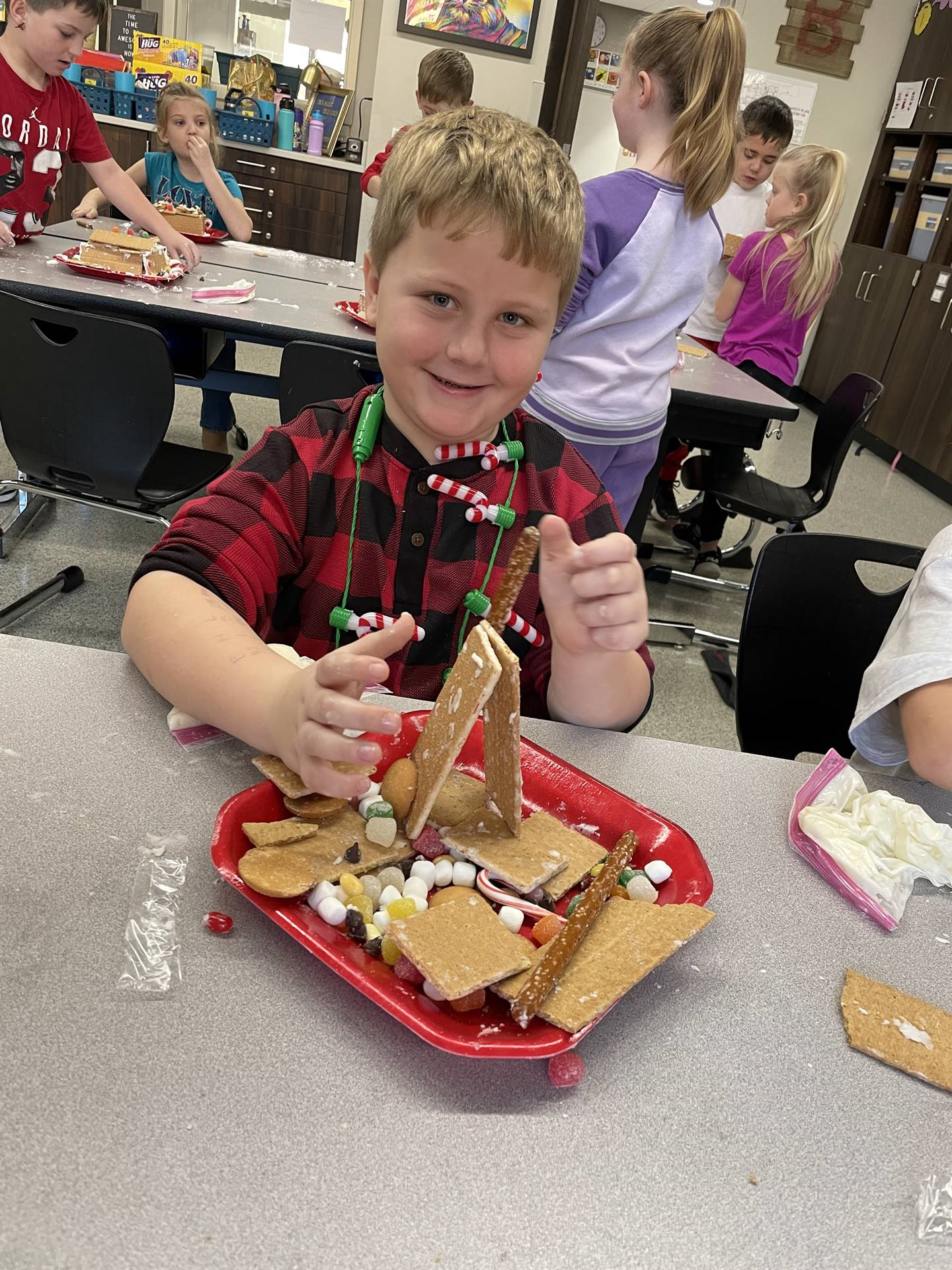 Jensen with gingerbread house