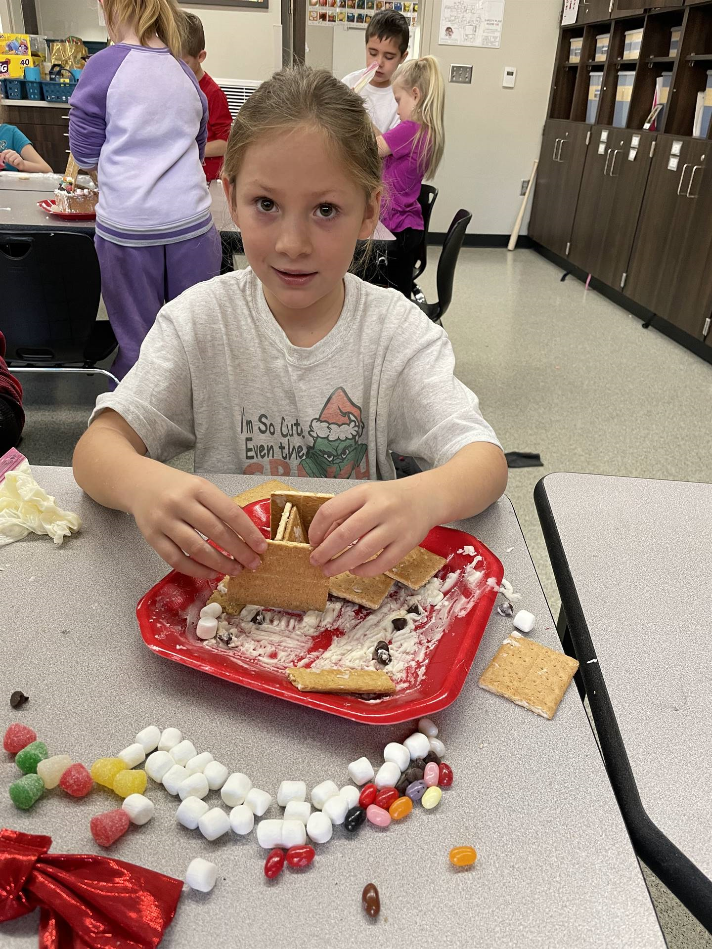 Kayla with gingerbread house