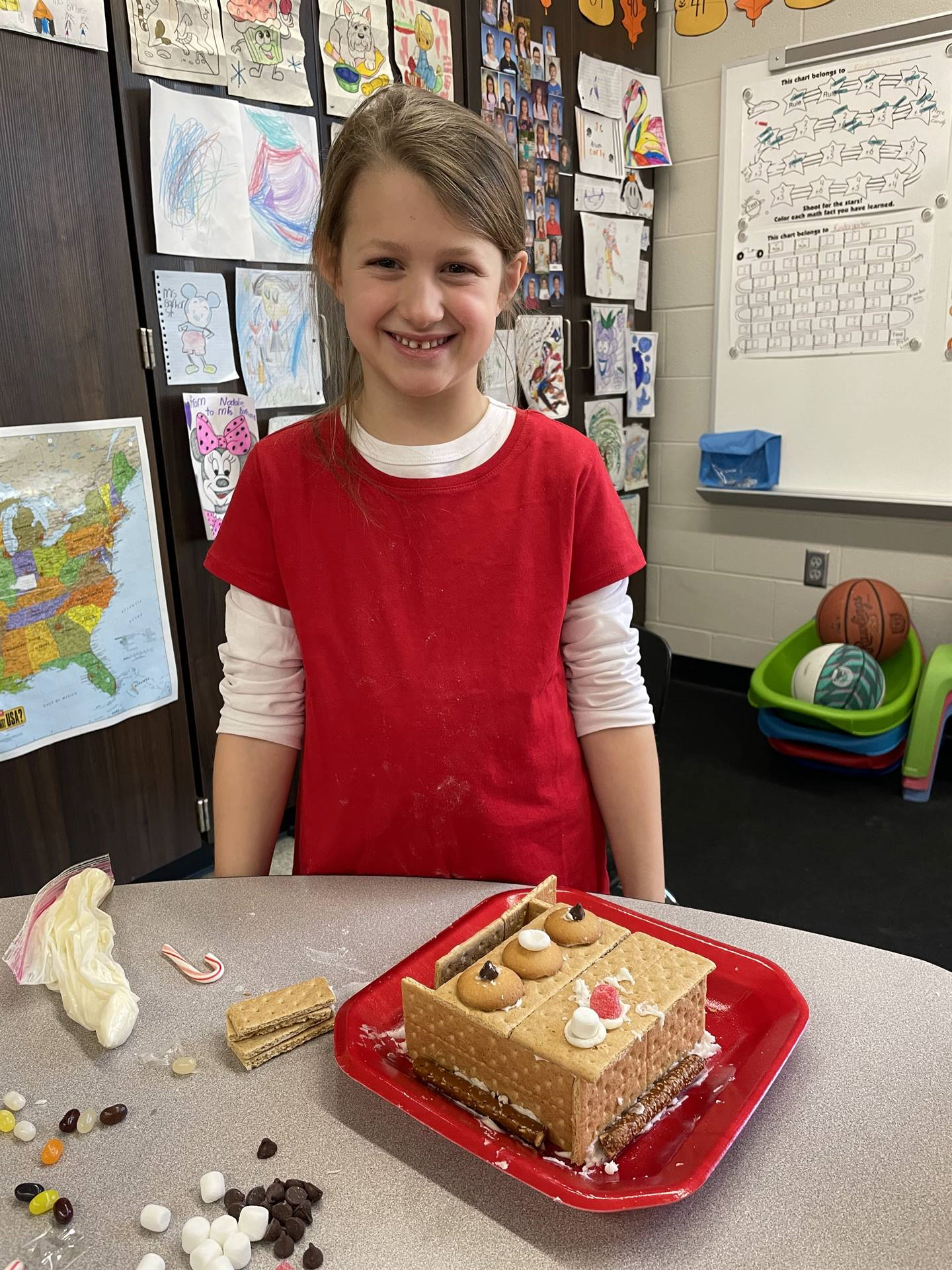 Chloe with gingerbread house