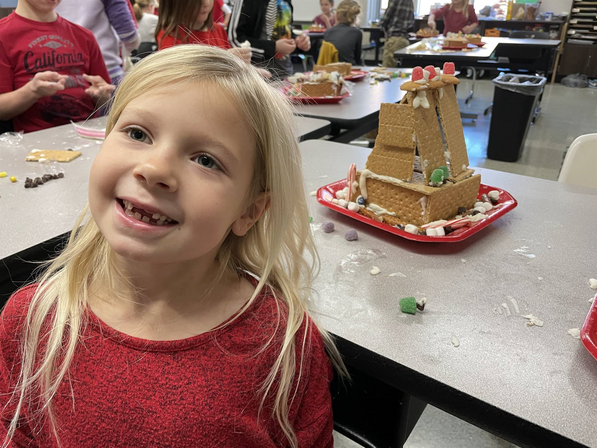Emma with gingerbread house