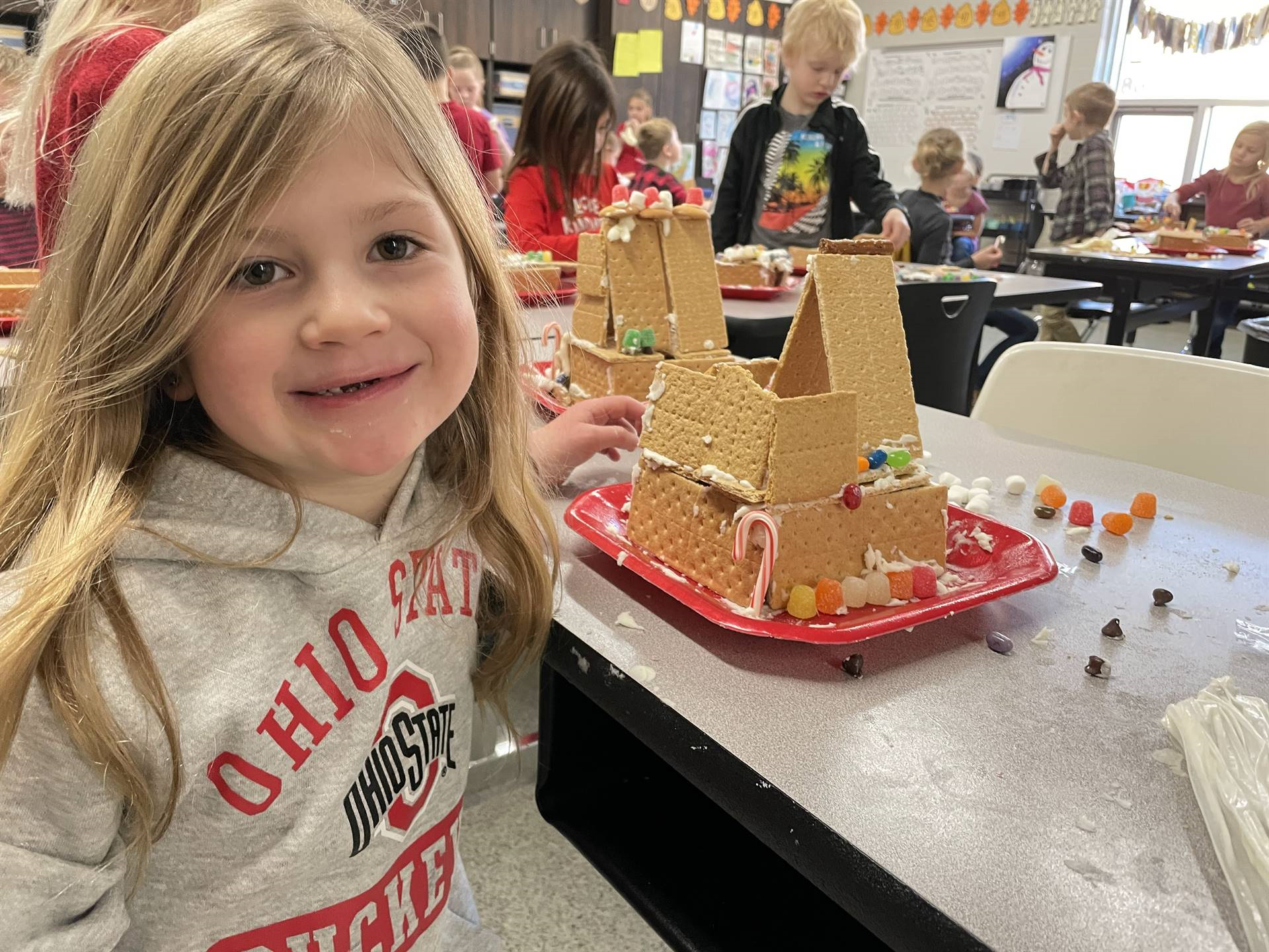 Isabelle with gingerbread house