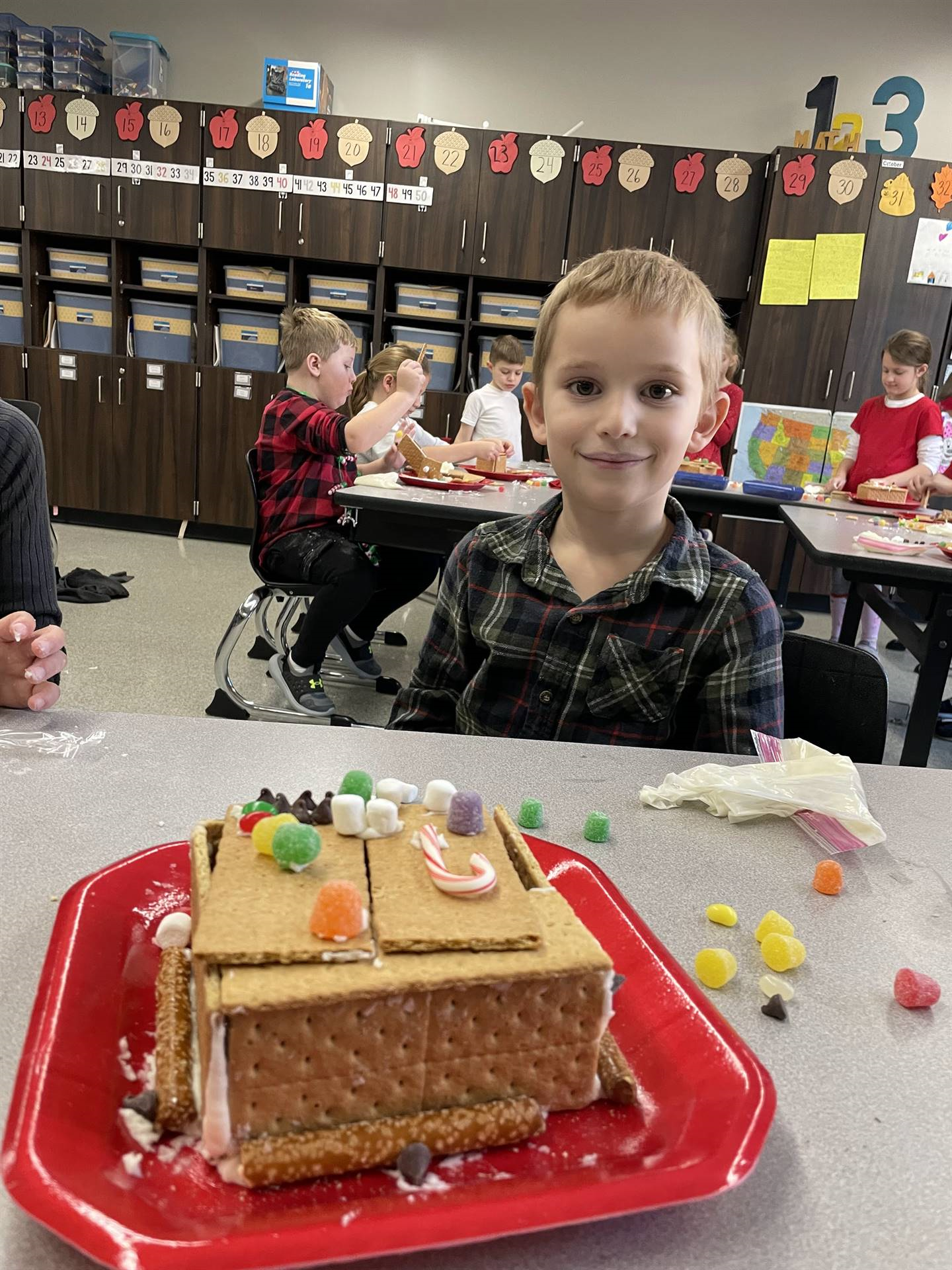 Levon with gingerbread house