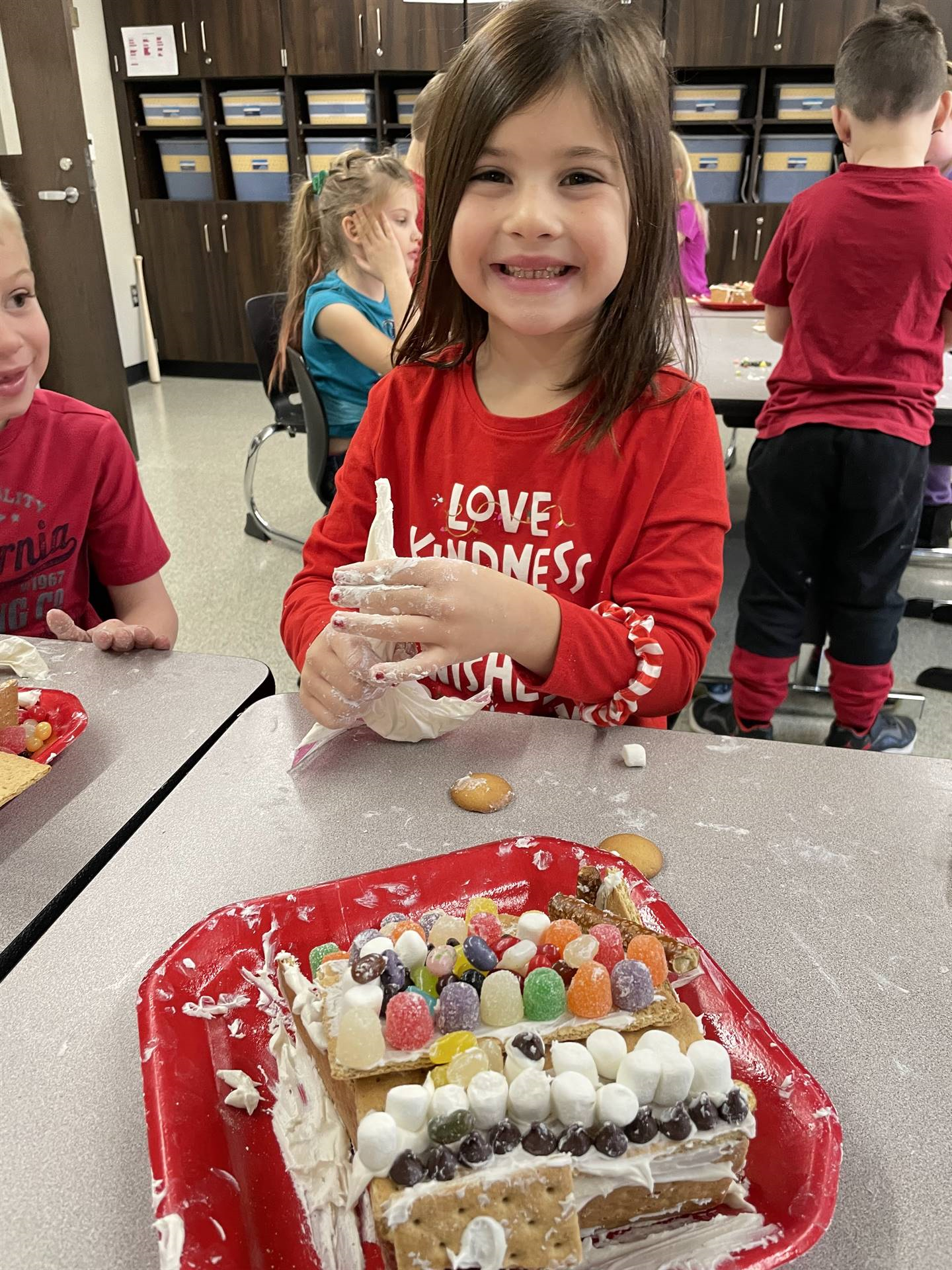 Natalie with gingerbread house