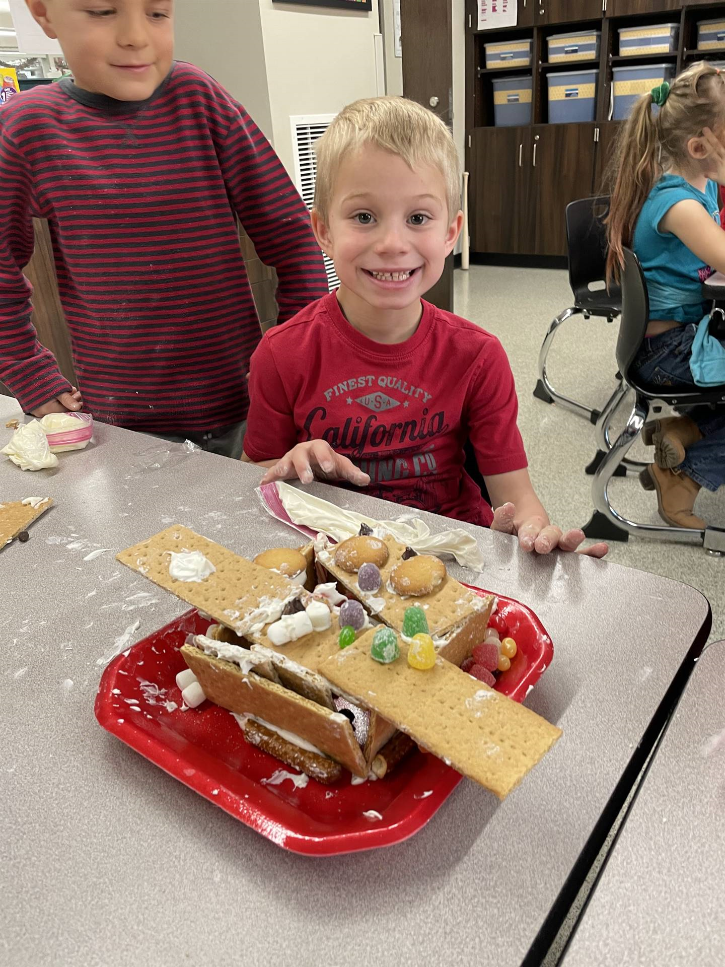 Anthony with gingerbread house