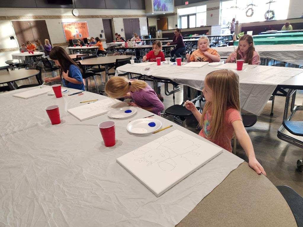 Cookies and Canvas - Kids starting to paint
