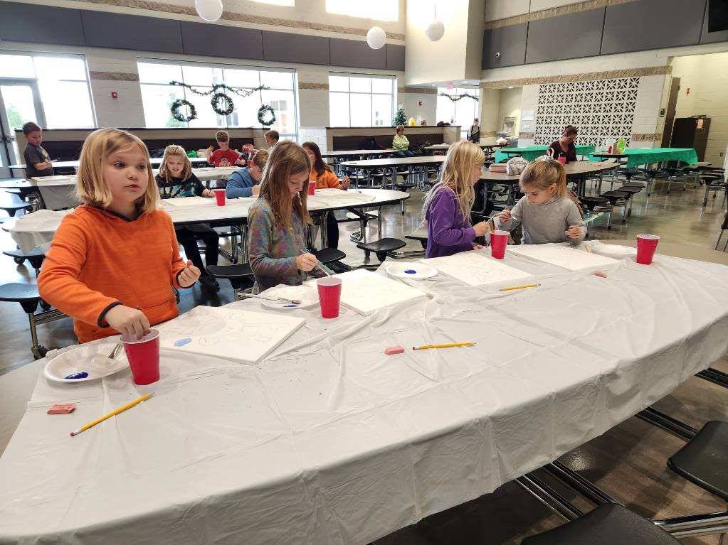 Cookies and Canvas - Kids starting to paint