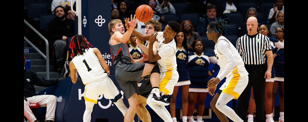 Boys Basketball Players going for the ball 