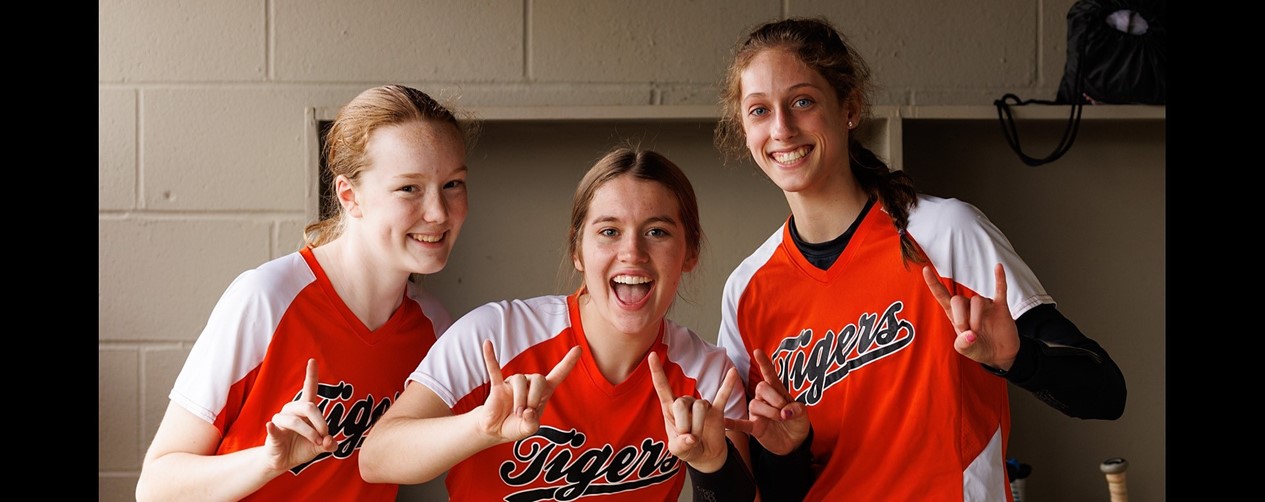 Softball players in the dugout