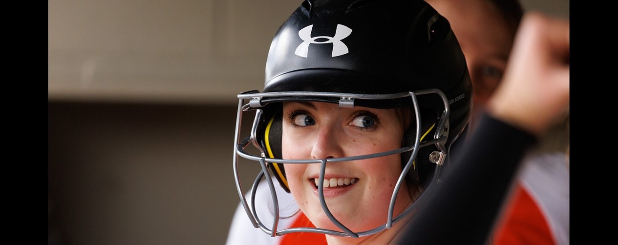 softball player in batting helmet