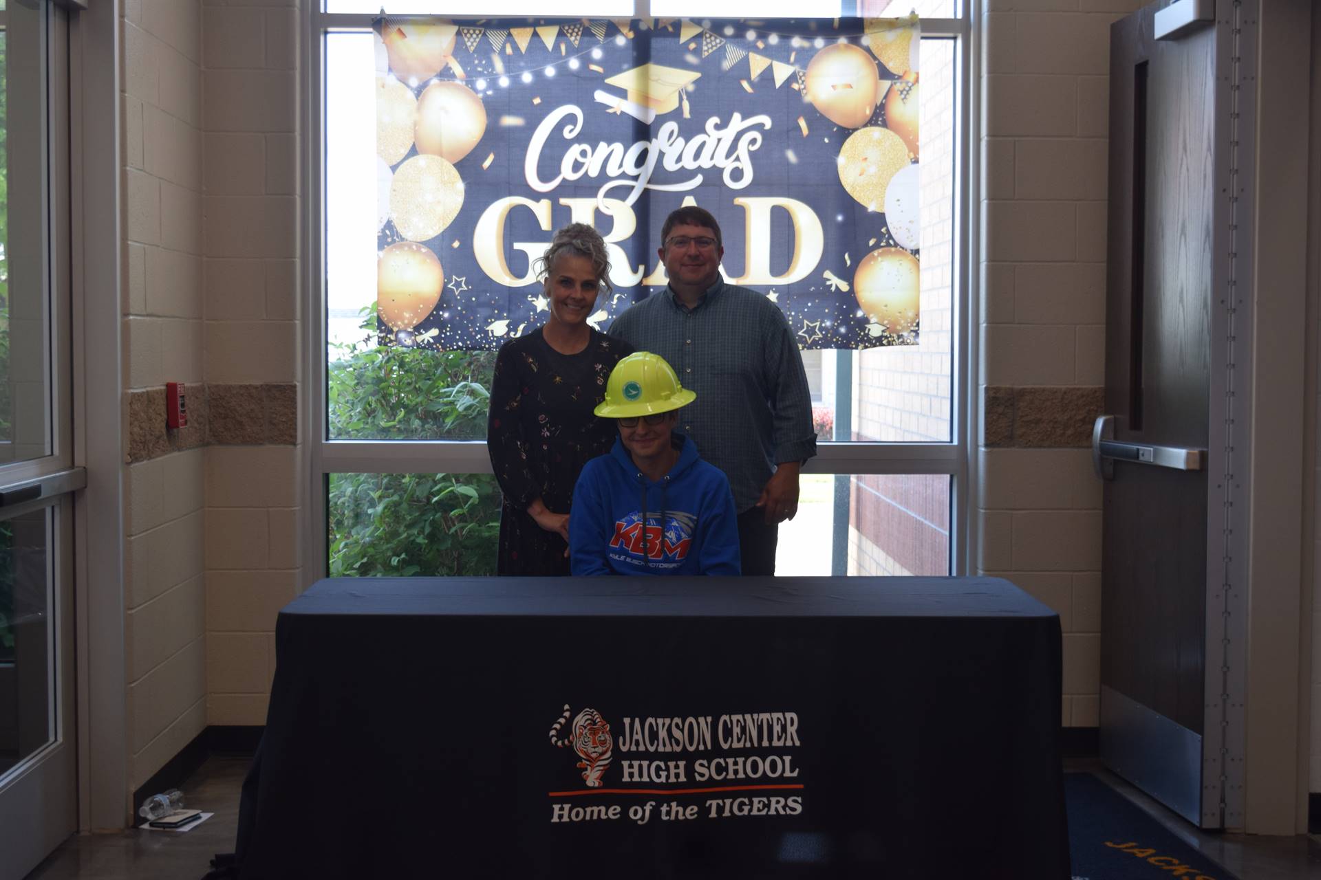 Eli Butcher and parents photo booth