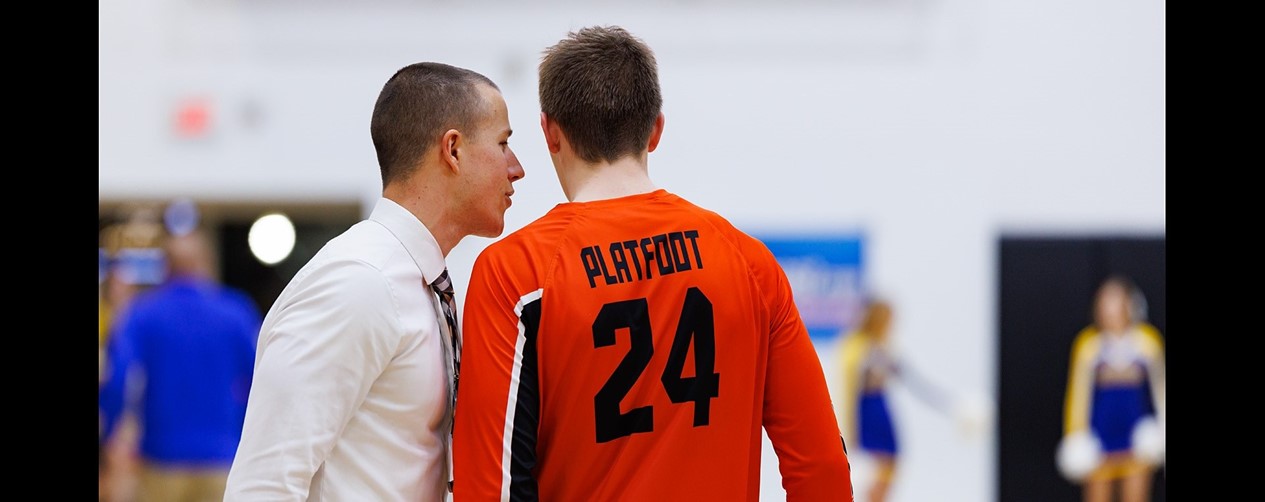 high school boys basketball player and head coach