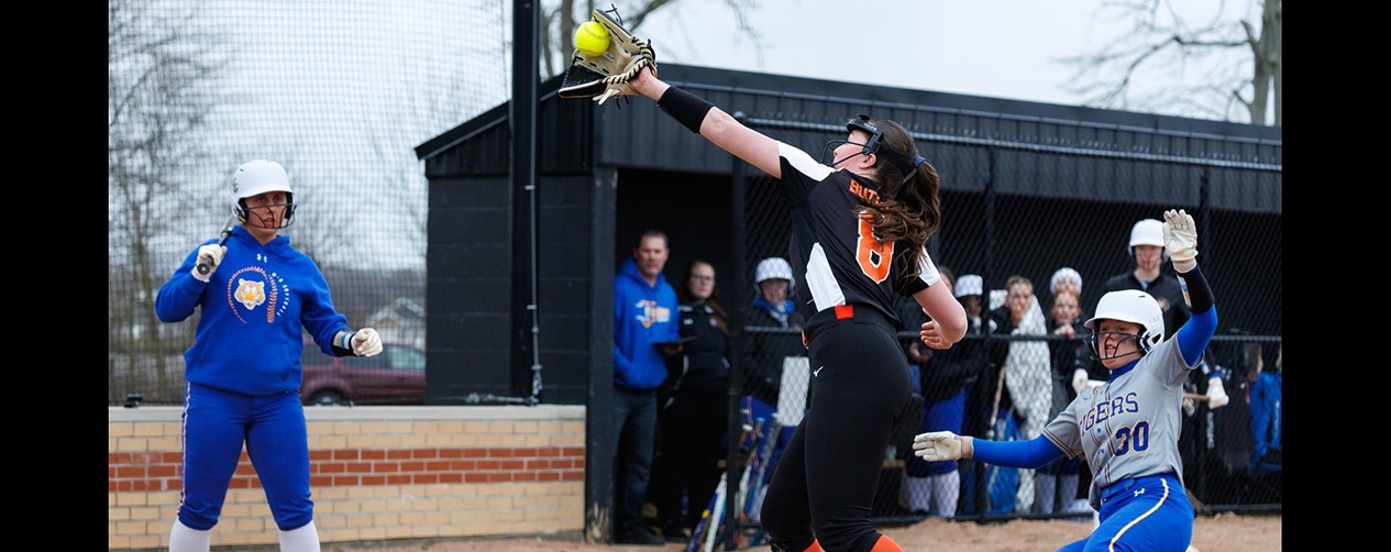 softball player catching infield fly