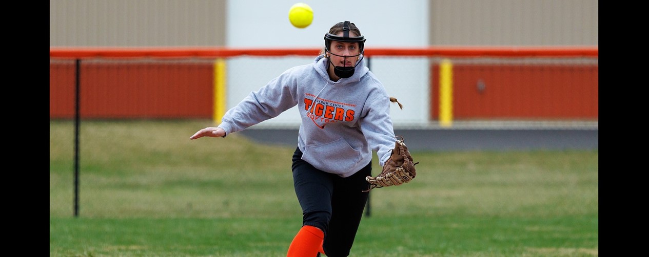 Softball player fielding ball