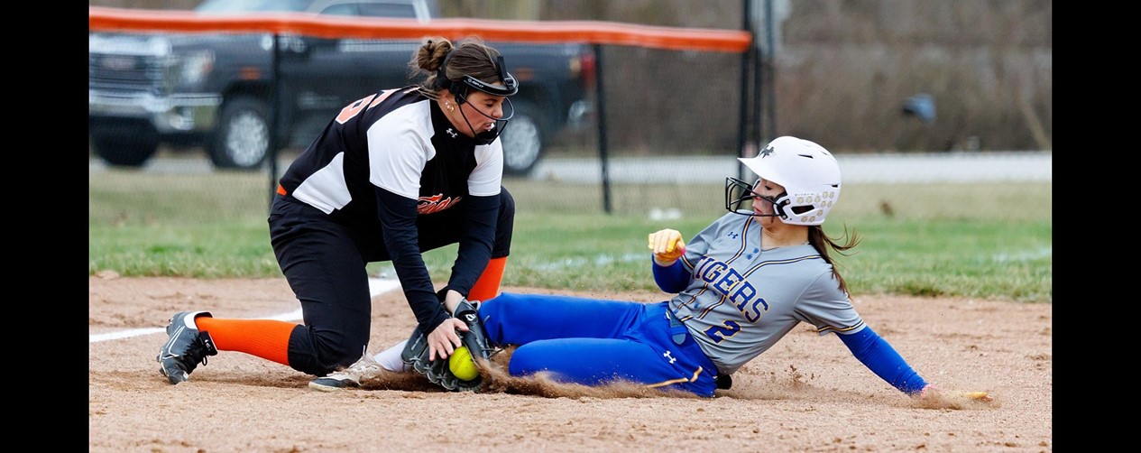 softball player tagging at the base
